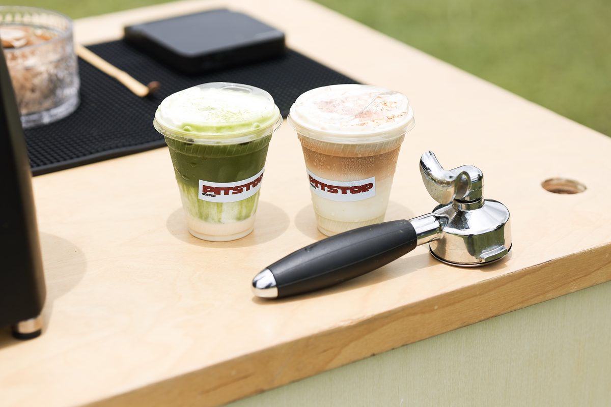 Two Pit Stop coffees, a matcha and a vanilla latte, side by side