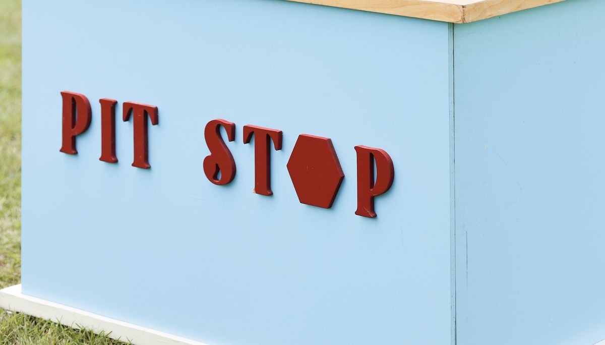 Close-up of the PIT STOP lettering on the cart's front panel